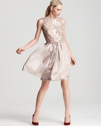 You're in party-perfect fashion in this stunning silver-sequined Escada dress, an airy silhouette for your special evening. Flaunting a deep v back, the luxe look is cinched at the waist with a self-tie belt for a statement finish. You're in party-perfect fashion in this stunning silver-sequined Escada dress, an airy silhouette for your special evening. Flaunting a deep v back, the luxe look is cinched at the waist with a self-tie belt for a statement finish.
