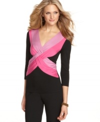 Brighten up with Cable & Gauge's twist-front top! The bold color pops against a background of flattering black. Brighten up with Cable & Gauge's twist-front top! The bold color pops against a background of flattering black.