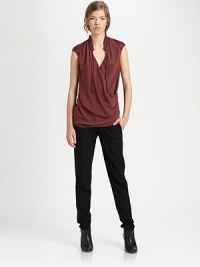 Gathered collar and gleaming leather cap sleeves top the draped crossover v-neck. Ruffle-trim neckline with self tiesCrossover v-neckLeather cap sleevesPolyesterDry cleanImportedModel shown is 5'10 (177cm) wearing US size Small. Gathered collar and gleaming leather cap sleeves top the draped crossover v-neck. Ruffle-trim neckline with self tiesCrossover v-neckLeather cap sleevesPolyesterDry cleanImportedModel shown is 5'10 (177cm) wearing US size Small.