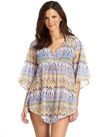 THE LOOKAllover floral paisley patternSurplice V-neckBell sleevesEmpire waist with drawstring closureCurved hemTHE FITAbout 28 from shoulder to hemTHE MATERIAL80% nylon/20% spandexCARE & ORIGINHand washMade in USA THE LOOKAllover floral paisley patternSurplice V-neckBell sleevesEmpire waist with drawstring closureCurved hemTHE FITAbout 28 from shoulder to hemTHE MATERIAL80% nylon/20% spandexCARE & ORIGINHand washMade in USA