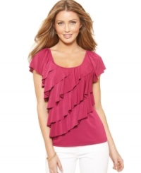 AGB takes the tee to fashionable new heights with tiers of diagonal ruffles for a softly-draped, feminine look. AGB takes the tee to fashionable new heights with tiers of diagonal ruffles for a softly-draped, feminine look.