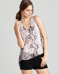 A cool contrast, this Aqua top boasts exotic snake print and soft pastels for a high-fashion look that moves from day to night in seamless stye. A cool contrast, this Aqua top boasts exotic snake print and soft pastels for a high-fashion look that moves from day to night in seamless stye.