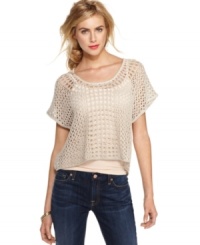 Slip into textured style with this chic layer from Kensie, where metallic thread subtly glimmers across a pullover of fishnet design. Slip into textured style with this chic layer from Kensie, where metallic thread subtly glimmers across a pullover of fishnet design.