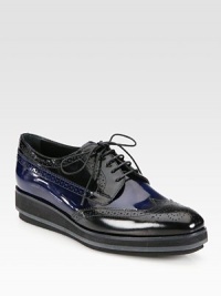 Bi-Color spazzolato design with a micro platform and wingtip detail. Foam wedge, 1¼ (30mm)Foam platform, ¾ (20mm)Compares to a ½ heel (15mm)Leather upperLeather liningRubber solePadded insoleMade in Italy Bi-Color spazzolato design with a micro platform and wingtip detail. Foam wedge, 1¼ (30mm)Foam platform, ¾ (20mm)Compares to a ½ heel (15mm)Leather upperLeather liningRubber solePadded insoleMade in Italy