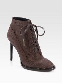 Perforated details decorate this lace-up ankle boot in subtly textured Italian leather, with a tall stacked heel. Stacked heel, 4 (100mm)Leather upperLeather lining and solePadded insoleMade in Italy