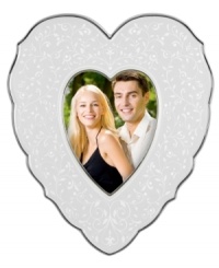 With the delicate vines, raised dots and platinum trim of the Lenox fine china collection, this Opal Innocence picture frame offers a look of classic elegance in a sweet heart shape. With the delicate vines, raised dots and platinum trim of the Lenox fine china collection, this Opal Innocence picture frame offers a look of classic elegance in a sweet heart shape.