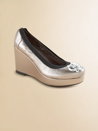 A gleaming metallic faux leather platform wedge, adorned with sparkly rhinestones on the toe.Faux leather upperContrast elastic edgingMicrosuede liningPadded insoleCovered wedgeRubber composite soleImported A gleaming metallic faux leather platform wedge, adorned with sparkly rhinestones on the toe.Faux leather upperContrast elastic edgingMicrosuede liningPadded insoleCovered wedgeRubber composite soleImported