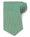 Slick dolphins do their tricks atop a classic silk tie from Salvatore Ferragamo.