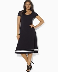 A timeless dress is rendered in a soft Pima cotton blend and finished with a flared skirt for a modern silhouette. A timeless dress is rendered in a soft Pima cotton blend and finished with a flared skirt for a modern silhouette.