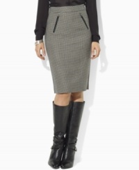 Look sophisticated and elegant at the office wearing Lauren by Ralph Lauren's chic wool houndstooth pencil skirt, accented with faux-leather trim and equestrian details. (Clearance)