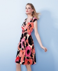 This flattering petite faux wrap dress from Alfani stands out with its vibrant, abstract print. From desk to dinner, it'll have you looking effortlessly stylish. This flattering petite faux wrap dress from Alfani stands out with its vibrant, abstract print. From desk to dinner, it'll have you looking effortlessly stylish.