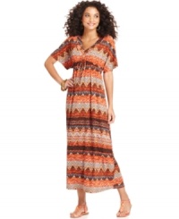 Make a bold statement in One World's maxi dress, featuring an allover mixed print and flattering silhouette. Make a bold statement in One World's maxi dress, featuring an allover mixed print and flattering silhouette.
