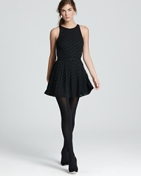 Enlivened with tonal polka dots, this fabulous little black DV Dolce Vita dress flounces into fall with party-perfect style. Enlivened with tonal polka dots, this fabulous little black DV Dolce Vita dress flounces into fall with party-perfect style.