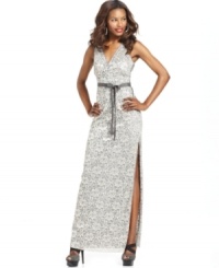 BCBGMAXAZRIA's luxe lace evening gown will steal the show with its sleek silhouette and sexy side slit. BCBGMAXAZRIA's luxe lace evening gown will steal the show with its sleek silhouette and sexy side slit.