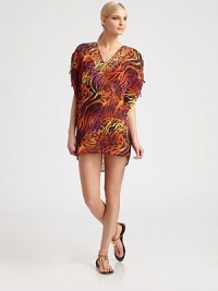 Paillettes adorn the neckline as the bold print gives this coverup a must-have status.Plunging necklineRuched and tie details on flutter sleevesPolyesterHand washImported Paillettes adorn the neckline as the bold print gives this coverup a must-have status.Plunging necklineRuched and tie details on flutter sleevesPolyesterHand washImported