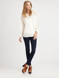 Loose-flowing silk top with long bishop sleeves, a hidden button front and hi-lo hem. V-neckHidden button frontLong bishop sleeves with buttoned cuffsHi-lo hemSilkDry cleanImportedModel shown is 5'10 (177cm) wearing US size Small. Loose-flowing silk top with long bishop sleeves, a hidden button front and hi-lo hem. V-neckHidden button frontLong bishop sleeves with buttoned cuffsHi-lo hemSilkDry cleanImportedModel shown is 5'10 (177cm) wearing US size Small.