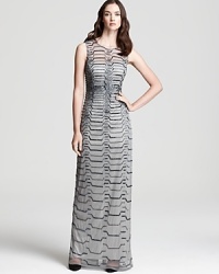 Geometric beading feels refreshingly modern on this Aidan Mattox gown, a study in chic minimalism. Geometric beading feels refreshingly modern on this Aidan Mattox gown, a study in chic minimalism.