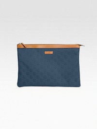 Nylon Guccissima trimmed with leather in a zip-top pouch.Top zip closureFully lined12W X 8½H X 1/4DMade in Italy Nylon Guccissima trimmed with leather in a zip-top pouch.Top zip closureFully lined12W X 8½H X 1/4DMade in Italy