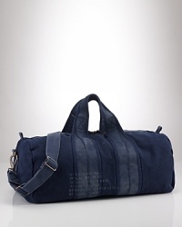A heavy-duty, barrel-style canvas duffel is the perfect go-anywhere bag with its ability to stand up to the elements and maintain vintage style. A heavy-duty, barrel-style canvas duffel is the perfect go-anywhere bag with its ability to stand up to the elements and maintain vintage style.