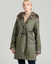 In utilitarian waxed cotton, this anorak-silhouetted jacket from WOOLRICH JOHN RICH & BROS. looks chic in the city and rustic in the woods. In utilitarian waxed cotton, this anorak-silhouetted jacket from WOOLRICH JOHN RICH & BROS. looks chic in the city and rustic in the woods.