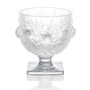 This petite vase, adorned with charming robins in flight, demonstrates the wonder of nature captured in crystal.