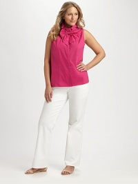 Versatile and stylish, this stretch cotton top features a ruffle collar that can be worn up or down and a detachable bow for added flirty flair.Ruffle collarSleevelessDetachable bowConcealed placketPrincess seamsAbout 25 from shoulder to hem72% cotton/23% polyamide/5% Lycra®Machine washImported of Italian fabric