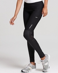 These workout-ready Nike leggings feature cooling mesh panels, reflective trim and Dri-FIT technology to wick away moisture. These workout-ready Nike leggings feature cooling mesh panels, reflective trim and Dri-FIT technology to wick away moisture.