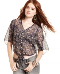 Loaded with delightful details, this top from Angie pairs breezy chiffon fabric with tie-front style. Loaded with delightful details, this top from Angie pairs breezy chiffon fabric with tie-front style.