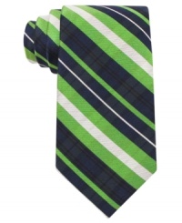 Bold stripes and vivid color make this Tommy Hilfiger silk tie a go-to when you're looking to make an impression. Bold stripes and vivid color make this Tommy Hilfiger silk tie a go-to when you're looking to make an impression.