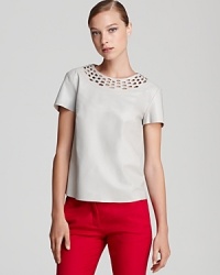 Articulated in supple leather, this DIANE von FURSTENBERG top features intricate cutout details for a seriously modern design. Articulated in supple leather, this DIANE von FURSTENBERG top features intricate cutout details for a seriously modern design.