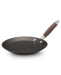 Bon appétit! It takes a true professional to whip up perfect crepes, and this bronze-hued pan does the job, evenly heating and crisping the delicate treats. The hard-anodized construction reduces hot spots for a deliciously golden finish, while DuPont Autograph® 2 nonstick makes it easy to flip the crepe without it losing shape. Limited lifetime warranty. Bon appétit! It takes a true professional to whip up perfect crepes, and this bronze-hued pan does the job, evenly heating and crisping the delicate treats. The hard-anodized construction reduces hot spots for a deliciously golden finish, while DuPont Autograph® 2 nonstick makes it easy to flip the crepe without it losing shape. Limited lifetime warranty.