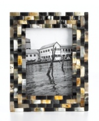 Tiled in lustrous black and tan buffalo horn, this Purva picture frame brings an exotic sensibility to modern decor and favorite photos. Tiled in lustrous black and tan buffalo horn, this Purva picture frame brings an exotic sensibility to modern decor and favorite photos.