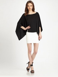 Semi-sheer back and emphasized poncho sleeves rejuvenate this lovely, lightweight design. BoatneckLong poncho sleevesSemi-sheer backPolyesterDry cleanImportedModel shown is 5'10 (177cm) wearing US size XS/S. Semi-sheer back and emphasized poncho sleeves rejuvenate this lovely, lightweight design. BoatneckLong poncho sleevesSemi-sheer backPolyesterDry cleanImportedModel shown is 5'10 (177cm) wearing US size XS/S.