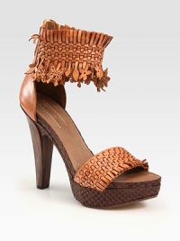 Elaborately woven leather and snakeskin design has artful butterfly cutouts at the ankle and a convenient back zipper. Wooden heel, 5 (125mm)Wooden platform, 1½ (115mm)Compares to a 3½ heel (90mm)Leather and snakeskin upperBack zipperLeather lining and solePadded insoleMade in Italy Elaborately woven leather and snakeskin design has artful butterfly cutouts at the ankle and a convenient back zipper. Wooden heel, 5 (125mm)Wooden platform, 1½ (115mm)Compares to a 3½ heel (90mm)Leather and snakeskin upperBack zipperLeather lining and solePadded insoleMade in Italy
