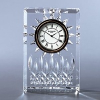 Tell time by this Lismore Clock. Tell style by Waterford elegance. Deeply patterned with both diamond and wedge cuts, this timepiece from our most classic collection is the epitome of panache. 4 1/2 high. Tell time by this Lismore Clock. Tell style by Waterford elegance. Deeply patterned with both diamond and wedge cuts, this timepiece from our most classic collection is the epitome of panache. 4 1/2 high.