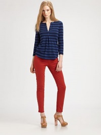 Bold striping lends a sporty touch to this classic henley silhouette finished with a flared baseball hem.Split V necklineThree-quarter sleevesInverted front pleat under necklineAbout 26 from shoulder to hem50% tencel/42% cotton/8% LycraMachine washMade in USAModel shown is 5'9½ (176cm) wearing US size Small. Bold striping lends a sporty touch to this classic henley silhouette finished with a flared baseball hem.Split V necklineThree-quarter sleevesInverted front pleat under necklineAbout 26 from shoulder to hem50% tencel/42% cotton/8% LycraMachine washMade in USAModel shown is 5'9½ (176cm) wearing US size Small.