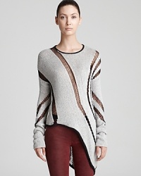 An oversized Helmut Lang sweater boasts sheer cutouts throughout the silhouette and an exaggerated, angled hem for a forward look that moves from day to night with downtown attitude. An oversized Helmut Lang sweater boasts sheer cutouts throughout the silhouette and an exaggerated, angled hem for a forward look that moves from day to night with downtown attitude.