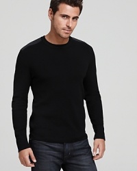 A Victorinox crewneck sweater features shoulder and elbow patches, reinforcing a refined military-inspired look. A Victorinox crewneck sweater features shoulder and elbow patches, reinforcing a refined military-inspired look.