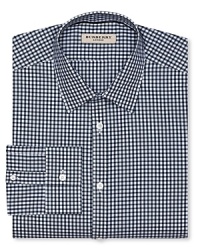 A masterful take on the classic gingham shirt, produced in superior cotton for comfort and fashioned in a contemporary fit for modern appeal. A masterful take on the classic gingham shirt, produced in superior cotton for comfort and fashioned in a contemporary fit for modern appeal.