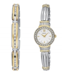 This beautiful Seiko watch is crafted with an elegant, antiquated look. Silvertone and goldtone bracelet and round case. Bezel crystallized by Swarovski elements. White dial with logo, goldtone stick indices and Roman numeral at twelve o'clock. Analog quartz movement. Water resistant to 30 meters. Two-year limited warranty. Matching bracelet crafted in sterling silver. Approximate length: 7-1/2 inches. This beautiful Seiko watch is crafted with an elegant, antiquated look. Silvertone and goldtone bracelet and round case. Bezel crystallized by Swarovski elements. White dial with logo, goldtone stick indices and Roman numeral at twelve o'clock. Analog quartz movement. Water resistant to 30 meters. Two-year limited warranty. Matching bracelet crafted in sterling silver. Approximate length: 7-1/2 inches.