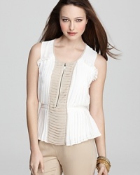 Precise pleating creates a captivating silhouette on this VINCE CAMUTO blouse, rendered in airy chiffon. Precise pleating creates a captivating silhouette on this VINCE CAMUTO blouse, rendered in airy chiffon.
