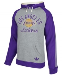 Keep warm as you cheer and rant for the LA Lakers in this pullover hoodie by adidas. Keep warm as you cheer and rant for the LA Lakers in this pullover hoodie by adidas.