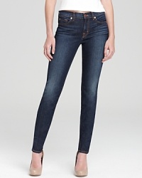 This sleek skinny silhouette from J Brand features artful fading for an authentic vintage feel. This sleek skinny silhouette from J Brand features artful fading for an authentic vintage feel.