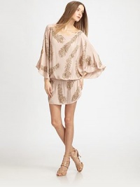 Sumptuous hand-beaded viscose drapes around the body in a billowing blouson silhouette with generous dolman sleeves.BoatneckDropped shouldersDolman sleevesBlouson bodiceDrawstring waistFitted skirtAbout 13 from natural waistViscoseDry cleanImported Model shown is 5'9½ (176cm) wearing US size Small. Sumptuous hand-beaded viscose drapes around the body in a billowing blouson silhouette with generous dolman sleeves.BoatneckDropped shouldersDolman sleevesBlouson bodiceDrawstring waistFitted skirtAbout 13 from natural waistViscoseDry cleanImported Model shown is 5'9½ (176cm) wearing US size Small.