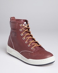 The high-top meets the workboot with Adidas' Hayworth sneaker, embellished with perforations, metal eyelets and contrast laces. The high-top meets the workboot with Adidas' Hayworth sneaker, embellished with perforations, metal eyelets and contrast laces.