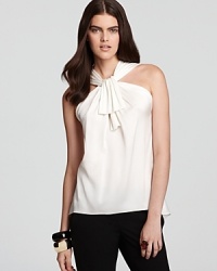 Make a dramatic entrance in this Elie Tahari blouse flaunting a decadent bow for an alluring, feminine style. Make a dramatic entrance in this Elie Tahari blouse flaunting a decadent bow for an alluring, feminine style.