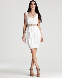 Tiers upon tiers of delicate eyelet lace cascade down the skirt of this dainty dress from Ali Ro. A neutral-hued belt anchors the ethereal look. Tiers upon tiers of delicate eyelet lace cascade down the skirt of this dainty dress from Ali Ro. A neutral-hued belt anchors the ethereal look.