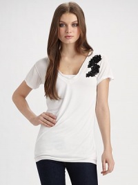 A wardrobe constant goes from simple to sophisticated, with its beautifully embellished lace appliqué.V-neck Pullover style Short sleeves Floral lace appliqué with sequins and beads About 27¼ from shoulder to hem Modal; hand wash Imported A wardrobe constant goes from simple to sophisticated, with its beautifully embellished lace appliqué.V-neck Pullover style Short sleeves Floral lace appliqué with sequins and beads About 27¼ from shoulder to hem Modal; hand wash Imported