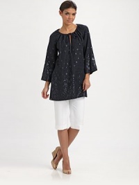 An enticing tunic with spectacular beading, a flattering fit and convenient slash pockets. Round neckSelf-tieThree-quarter sleevesSlash pocketsPull-on styleAbout 32 from shoulder to hemLinenDry cleanImported An enticing tunic with spectacular beading, a flattering fit and convenient slash pockets. Round neckSelf-tieThree-quarter sleevesSlash pocketsPull-on styleAbout 32 from shoulder to hemLinenDry cleanImported
