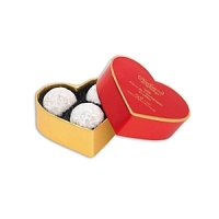 Lightly dusted milk chocolate truffles with a milk chocolate butter and Marc de Champagne center. Lightly dusted milk chocolate truffles with a milk chocolate butter and Marc de Champagne center.